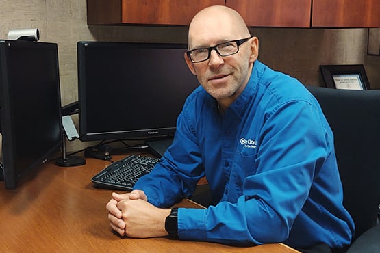 Darryl Jorgenson sits at his desk at Gate City Bank in Grand Forks ND