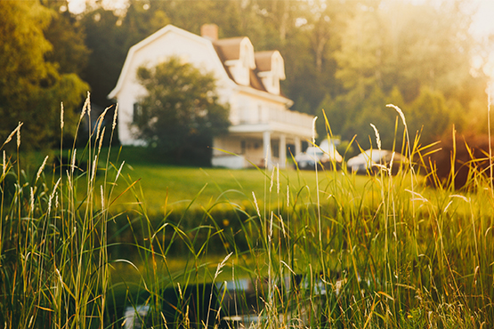 rural homestead at sunset that was recently financed with a development loan through gate city bank