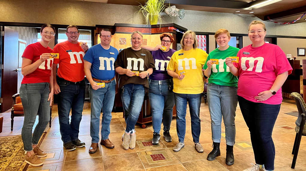 Elizabeth Radil and her fellow team members in Alexandria Minnesota pose for a pictured while dressed as Em-and-Ems for Halloween