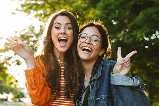 Two young girls at a local park in Moorhead, Minnesota after earning $100 from Gate City Bank by opening a checking account