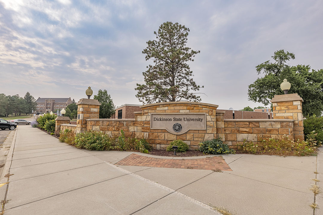 Evening view of Dickinson State University's sign at the edge of campus in Dickinson, North Dakota