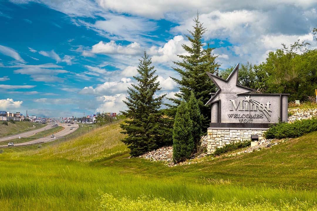 Welcome sign greeting visitors at the edge of Minot, North Dakota