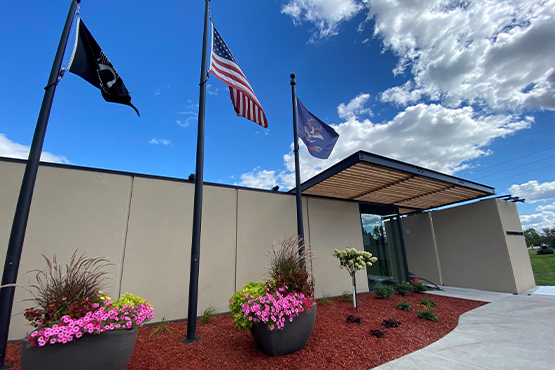 flags wave outside the entrance of Veterans Memorial Park in Grand Forks ND