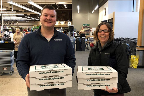 happy local essential workers receive pizzas from Gate City Bank during COVID-19