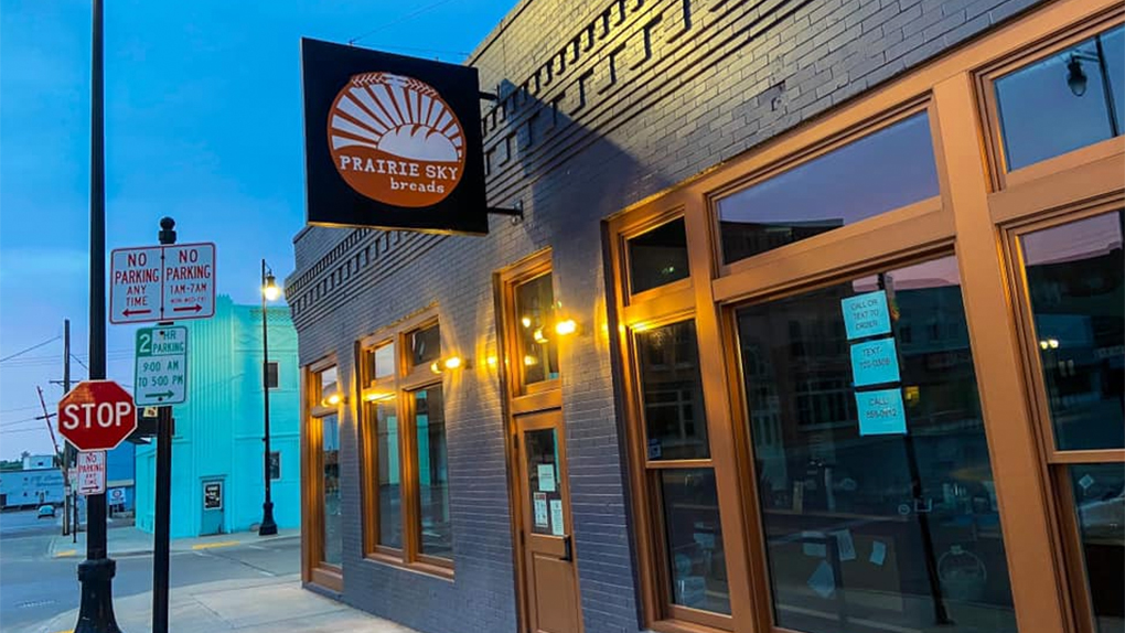 Prairie Sky: picture of the Prairie Sky Breads outdoor sign at sunset in Minot ND