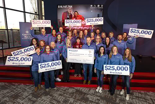 Gate City Bank team members present a large check to Heart-n-Soul Community Café, which won the $25,000 Giving Hearts Day nomination contest