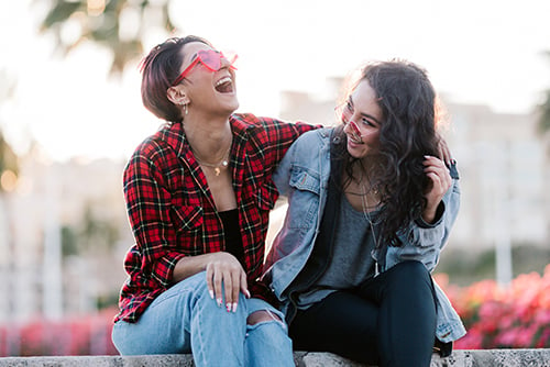 group of women friends posing for a goofy picture to go on a custom debit card