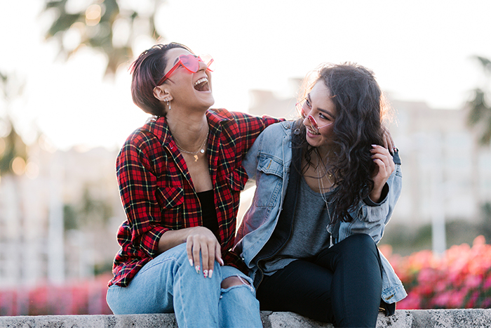 group of women friends posing for a goofy picture to go on a custom debit card