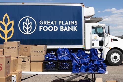 A Great Plains Food Bank truck in Fargo, ND, waits to be loaded with boxes and bags of donations from the Giving Hearts Food Drive.