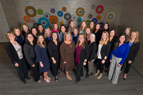 group of Gate City Bank women leaders poses for picture