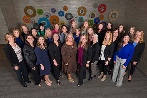 group of Gate City Bank women leaders poses for picture