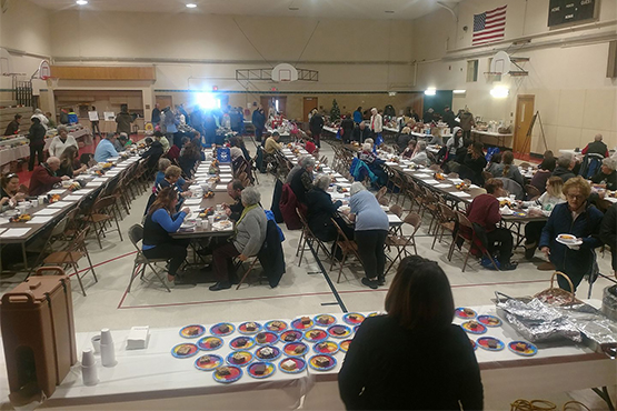 Grand Forks community members line rows of tables and fill a gymnasium to hold the annual fundraiser for Empty Bowls