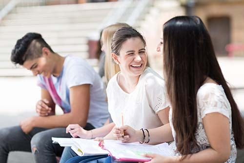 happy students complete homework after using their gate city bank checking account