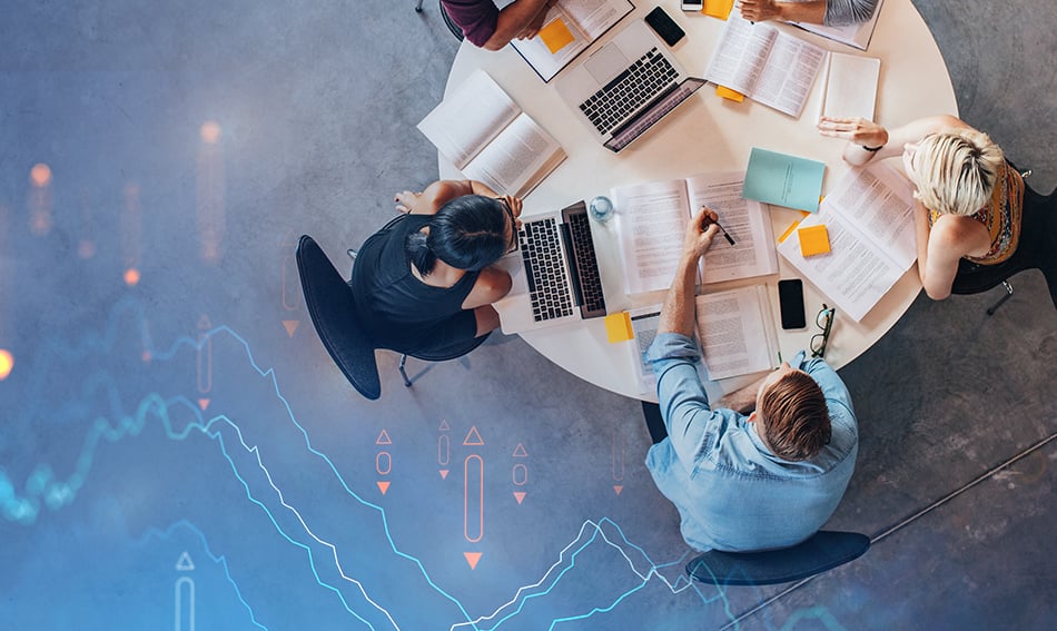 group of savvy individuals work around a table to collaborate on securing devices with gate city bank