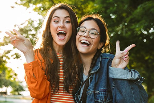 Two young girls at a local park in Moorhead, Minnesota after earning $200 from Gate City Bank by opening a checking account