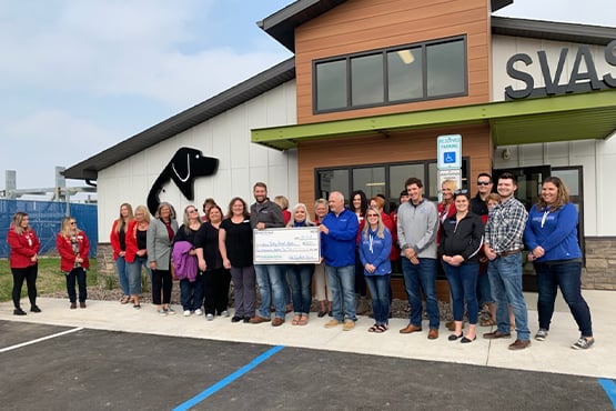 Gate City Bank team members and Souris Valley Animal Shelter partners hold big check