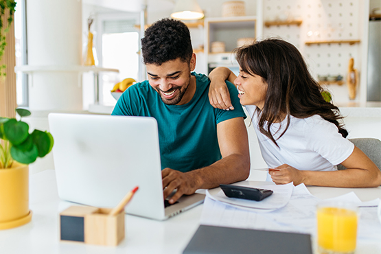 young couple happily avoids overdraft charges by following best practices from gate city bank