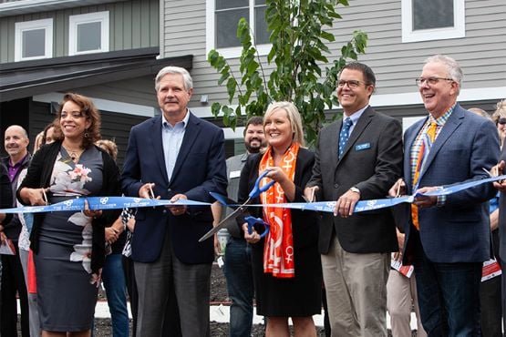 state delegates YWCA staff and team members hold a ribbon cutting for Grace Garden