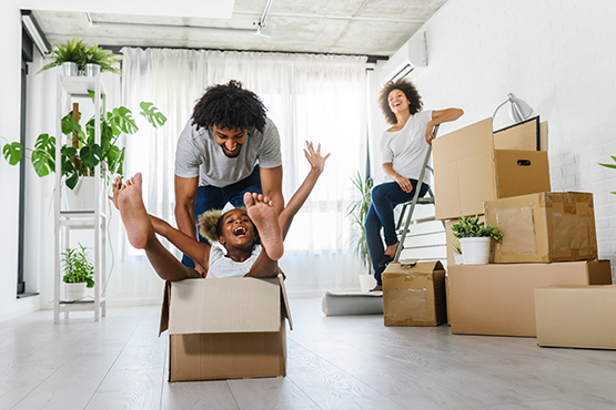 Laughing family moves into new home after getting a mortgage from Gate City Bank