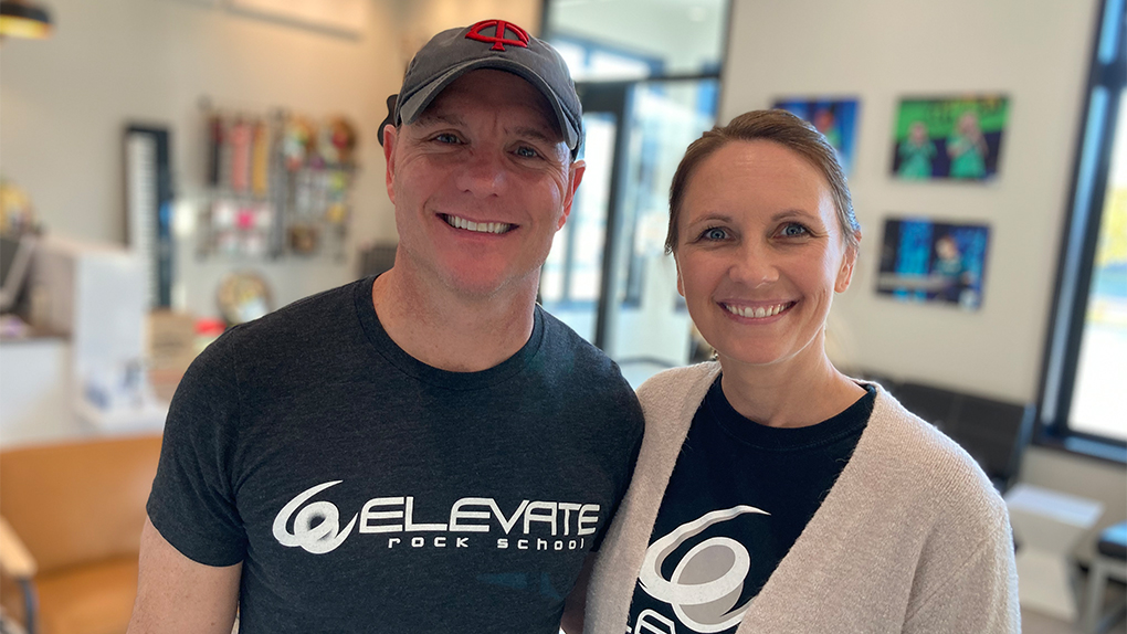 Elevate Rock School owners Bryce and Lisa Niemiller smile for the camera