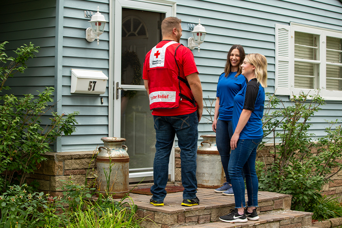 Gate City Bank team members visit a citizen’s home to discuss smoke alarm safety