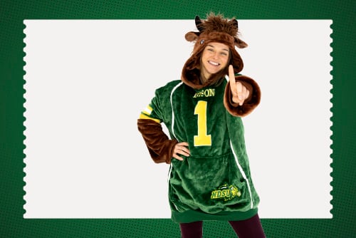 NDSU student wearing a Bison Snugible, smiling after opening her checking account in downtown Fargo, ND