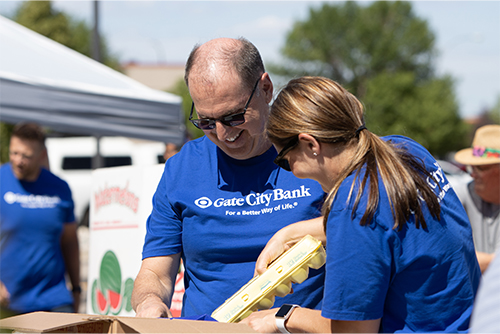 Bank President and CEO Kevin Hanson and others volunteer for West Fargo Eats