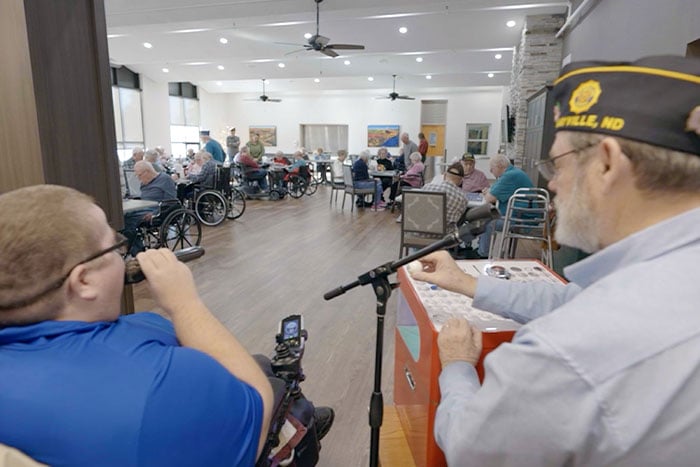 Volunteers call bingo on a machine donated in part by a Gate City Bank donation at Luther Memorial Home in Mayville, ND.