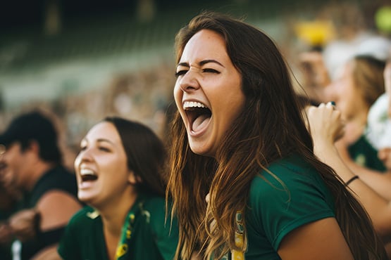 NDSU Bison fans cheering in Fargo, ND, near the Gate City Bank Fan Corner at the Fargodome