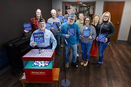 A group photo of American Legion members and Gate City Bank team members, who helped fund a new bingo machine at Luther Memorial Home in Mayville, ND.