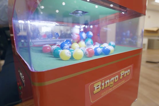 Colorful balls bounce around a new bingo machine Gate City Bank helped fund at Luther Memorial Home in Mayville, ND.