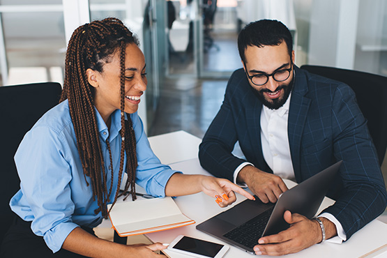 A small-business owner meets with a business banking lender in Fargo, ND