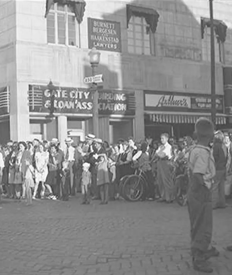 1920s black and white photo of community members gathering in front of Gate City Building and Loan Association building