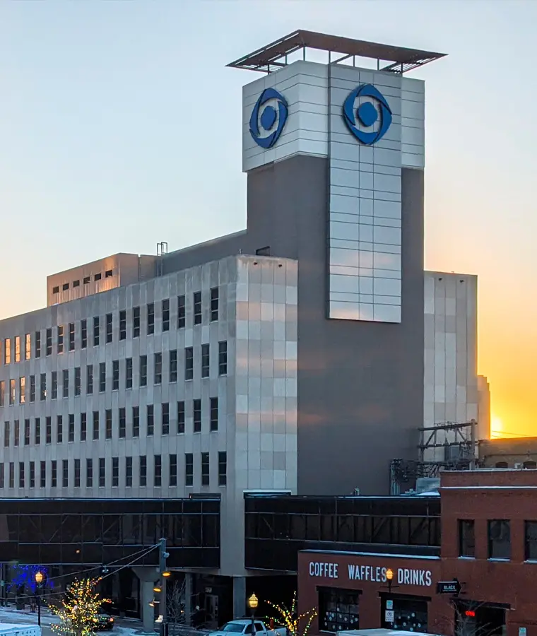 2020s outside view of the present-day Gate City Bank headquarters building in front of sunrise in downtown Fargo North Dakota