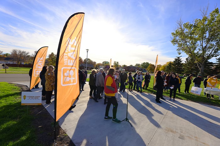 Outdoor ribbon cutting event at West Fargo Eats location.